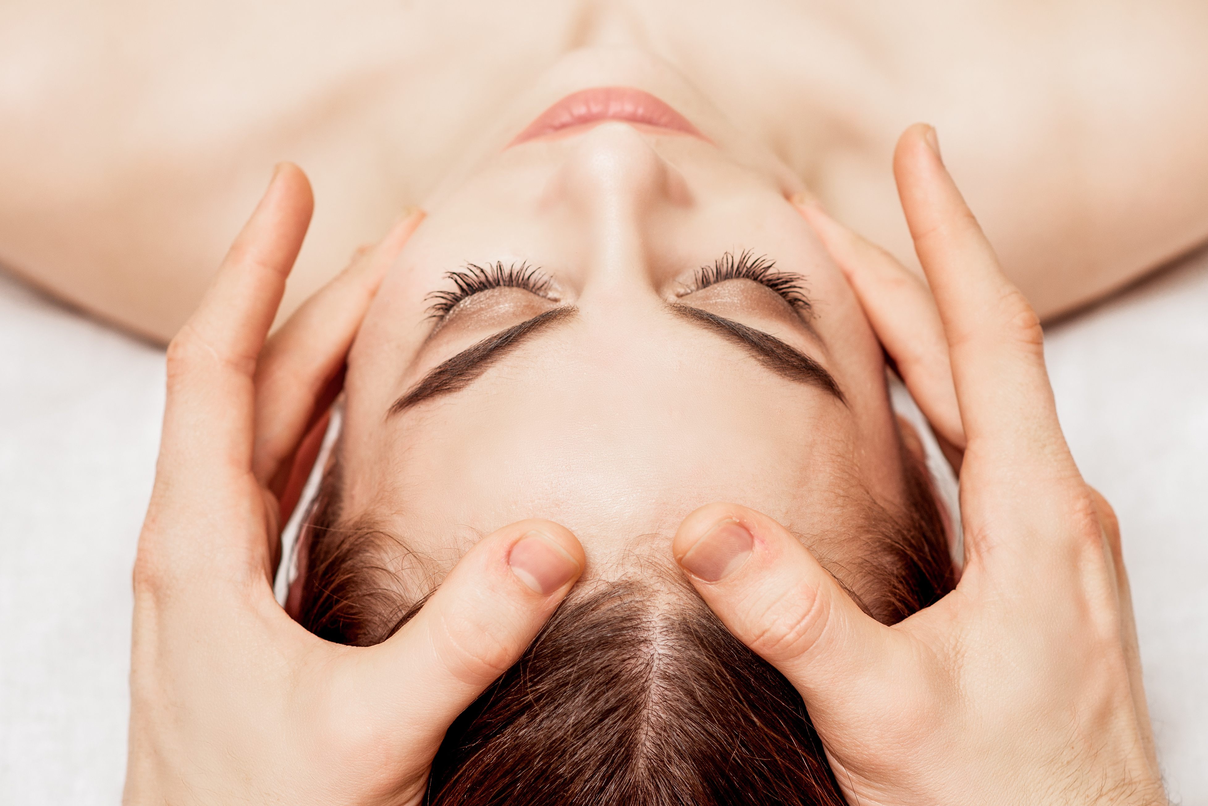 Woman Receiving Head Massage in a Spa